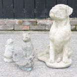 A cast stone garden statue of a dog