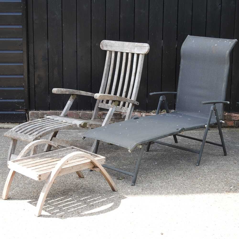 A teak steamer chair, lounger and stool