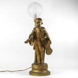An early 20th century figural table lamp