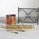 A copper coal bucket, brass fender and fire tools