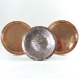 A pair of Arts and Crafts copper dishes