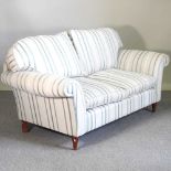 A modern striped upholstered sofa