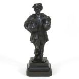 A bronze figure of a man