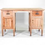 A pine pedestal desk