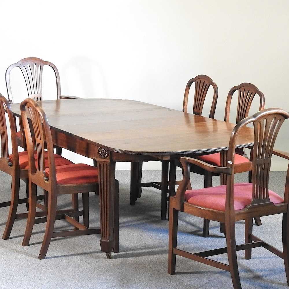An Edwardian dining table and chairs
