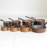 A collection of copper pans