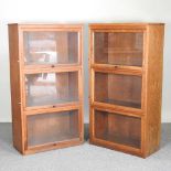 A pair of glazed oak bookcases