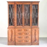 A reproduction glazed bookcase