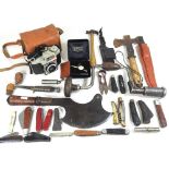 A collection of hand tools and knives