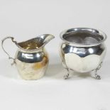 A silver cream jug and sugar bowl