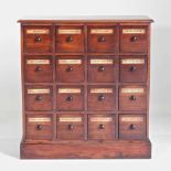 A mahogany apothecary cabinet