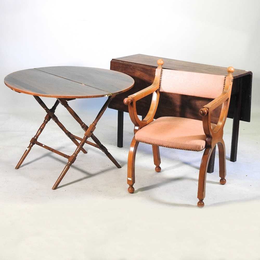 An armchair and two tables