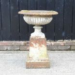 A cast iron garden urn