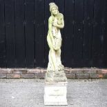 A cast stone garden statue