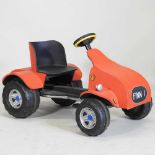 A children's ride-on pedal car