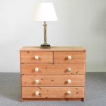 A pine chest and table lamp