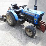 SATURDAY; DAY TWO - An Iseki compact tractor with cutter