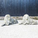 A pair of cast stone lions