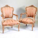 A pair of French arm chairs