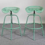 A pair of tractor seat bar stools