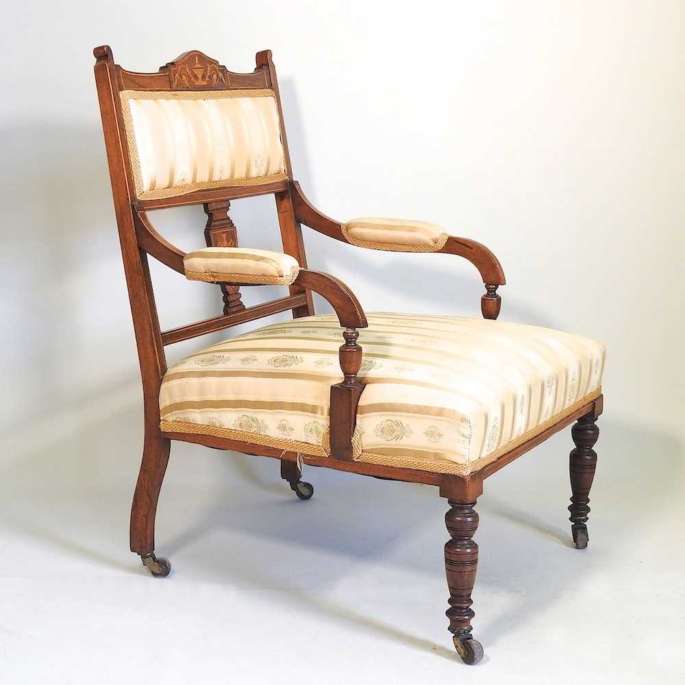 An Edwardian inlaid armchair