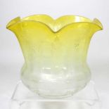 A yellow etched glass oil lamp shade