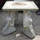 A cast stone garden table