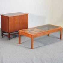 A teak table and cabinet