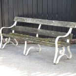 An iron and slatted garden bench