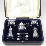 A silver condiment set