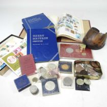 A collection of coins and stamps