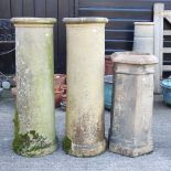 A pair of chimney pots and another