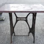 A cast iron Singer table