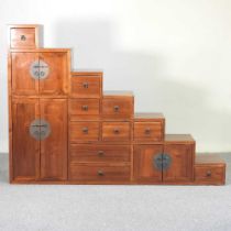 An Oriental hardwood cabinet