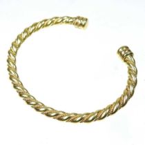 An 18 carat gold bangle