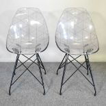 A pair of modern perspex chairs