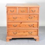 A pine chest of drawers