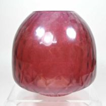 A red oil lamp shade