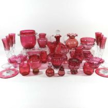 A collection of cranberry glass