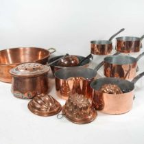 A set of five graduated copper saucepans