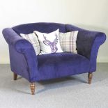 A blue upholstered sofa