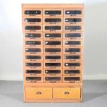 A mid 20th century haberdashery cabinet