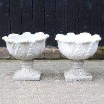 A pair of stone urns