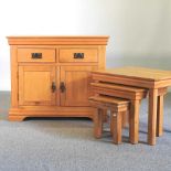 A light oak cabinet and tables