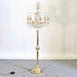 An ornate brass floor lamp