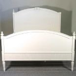 A white painted bedstead