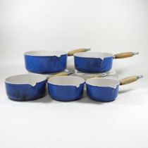 A set of Le Creuset saucepans