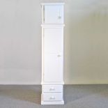 A modern white painted pine cabinet