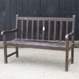 A brown painted garden bench
