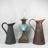 A Victorian oil lamp and two jugs